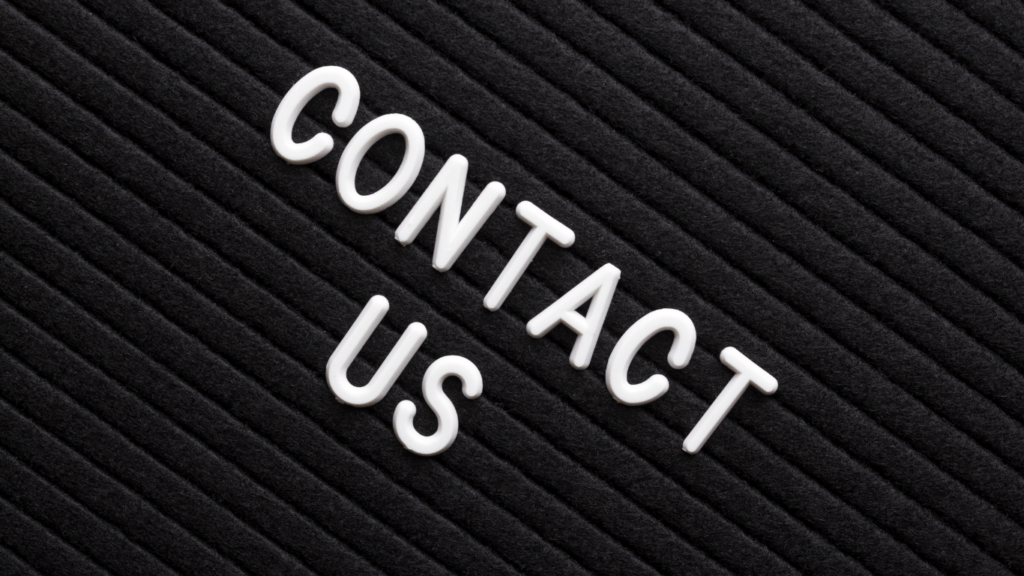 contact us text on black letter board