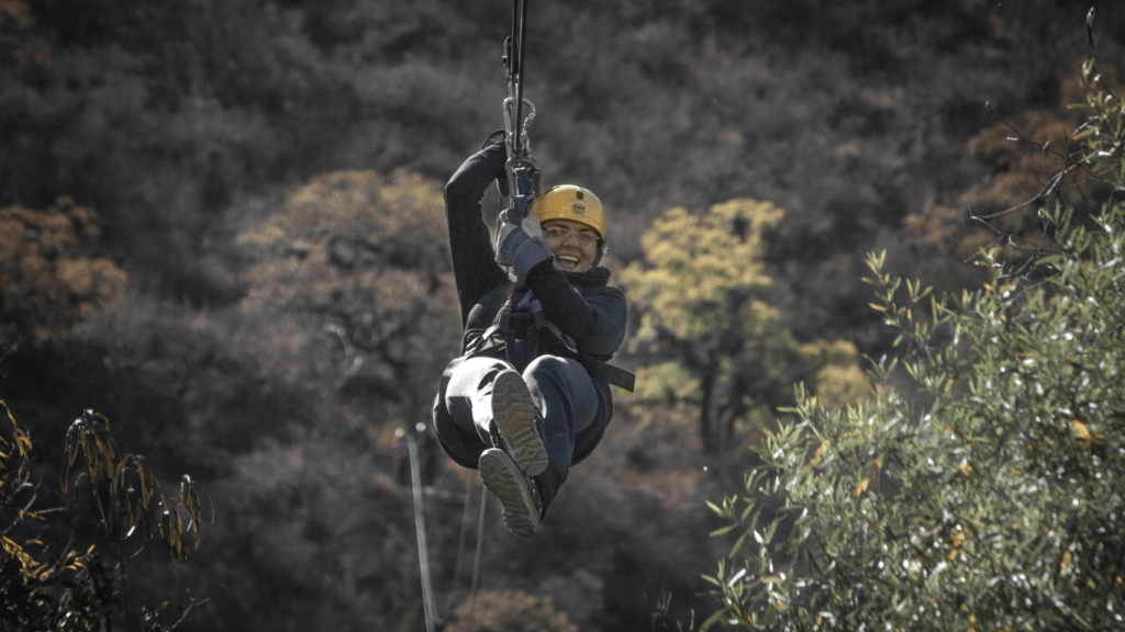 a person in a zip line