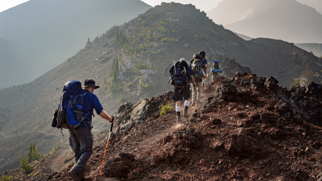 a group of people hiking in the mountain