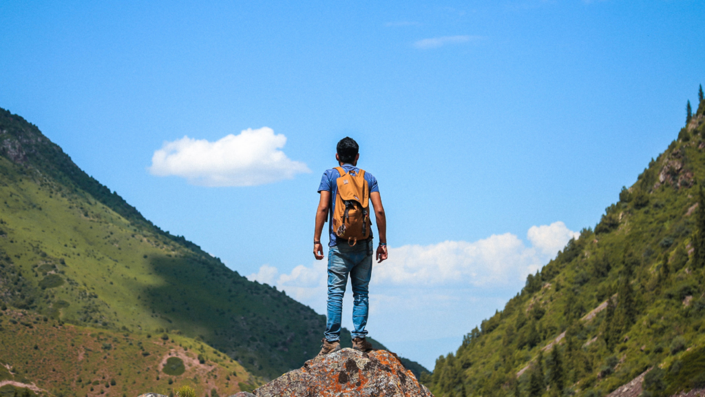 man on top of mountain